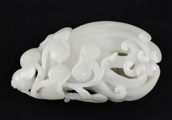 A Chinese white jade carving of a finger citron, lingzhi fungus and fruit sprigs, 19th/20th century, 10.5cm